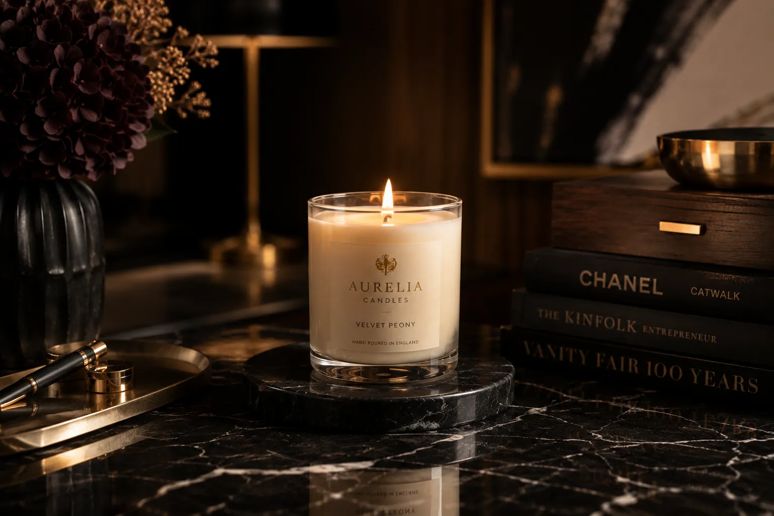 A premium candle in a heavy crystal vessel photographed as a luxury object on marble